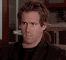 Celebrity gif. Ryan Reynolds looks around slowly with a puzzled expression on his face.