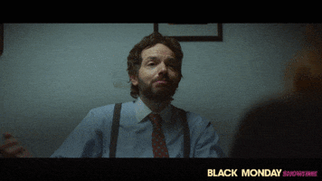 TV gif. Paul Scheer as Keith in Black Monday throws his arms out and leans back with a smile as he says, "Do it!"