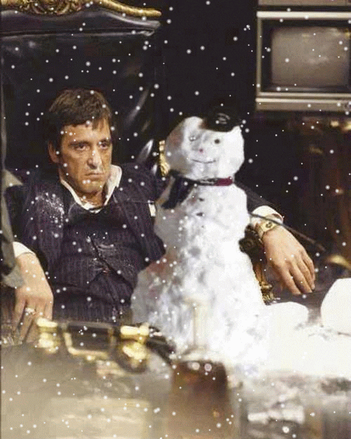 Movie gif. Al Pacino as Tony Montana in Scarface sits behind a desk covered in cocaine, leaning back in his chair with a stern disgruntled look on his face. A superimposed smiling snowman sits on top of the cocaine, snowflakes falling all around them both. 