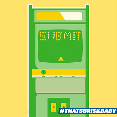 Ad gif. Illustrated green arcade game console against a yellow background with a screen that reads "Submit" in pixelated letters. Text banner at the bottom reads "#ThatsBriskBaby."
