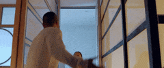 Celebrity gif. Rapper Anderson Paak fights with a woman, they scream and argue with each other.