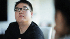 Video gif. A man does a dramatic nod, looking over his glasses at someone with a sassy, sarcastic expression. 