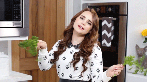 woman waving parsley gif