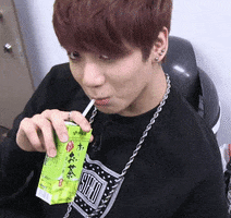 Celebrity gif. As we scroll to the left, we pause to see Jungkook from BTS sipping a juice box.