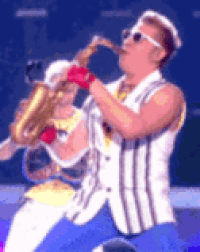 Meme gif. Epic Sax Guy performs onstage, wearing sunglasses while playing the saxophone and rhythmically thrusting his hips.