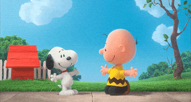 Peanuts gif. Charlie Brown squats on a sidewalk with his arms open, and Snoopy flies in to hug him as they both smile contentedly.