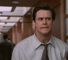 Movie gif. Jim Carrey as Fletcher in Liar Liar leans back and makes his fingers crawl across his face like spiders like he's horrified at what he's looking at.