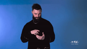 Celebrity gif. Mikky Ekko pretends to type something on a phone and then reacts with a surprised “ooooh.”