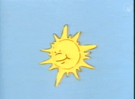 Video gif. Cartoony smiling sun shines in the blue sky, then the frame cuts to live-action woman wearing a head covering pointing up and saying "look, the sun," which appears as text.