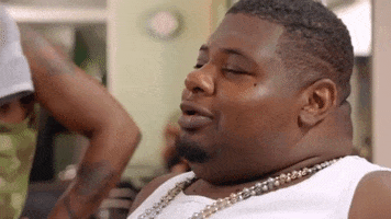 Celebrity gif. Rapper Big Narstie reacts to something funny, throwing his head back and chuckling in amusement.
