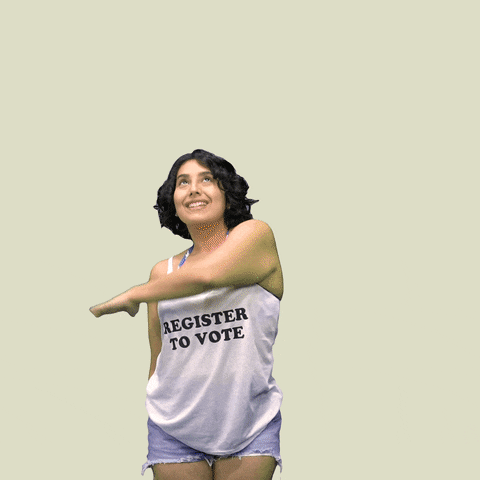 Video gif. Woman wearing a “Register to Vote” tank top over beige background waves an arm over her head in an arch, revealing a sparkling rainbow that reads, “Be a poll worker.”
