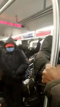 New York City Commuters Fill Train After Coronavirus Restrictions Take Effect