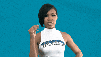 Video gif. A Charlotte Hornets cheerleader snaps her fingers twice, the second time her snap bursts into flames, and she smiles.