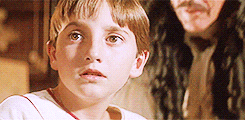Gif of Captain Hook holding up, well, his hook, and a little boy staring in horror and awe