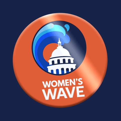 Digital art gif. Orange button featuring a blue wave splashing over the U.S. capitol building shakes back and forth over a navy background. The button reads, “Women’s Wave.”