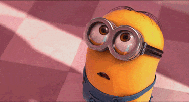 Despicable Me gif. Minion takes a couple steps while looking up, awestruck, his mouth turning up into a smile.
