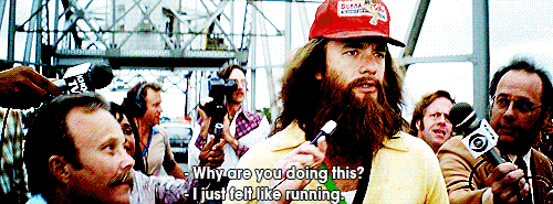Movie gif. Tom Hanks as Forrest Gump running and being swarmed by reporters trying to talk to him. Text, "Why are you doing this? I just felt like running."