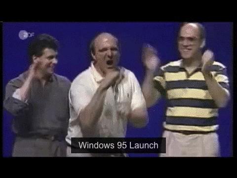 Microsoft execs dancing awkwardly at Windows 95 launch party.