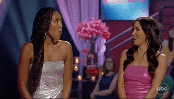 Reality TV gif. Tayisha Adams and Kaitlyn Bristowe on The Bachelorette turn towards each other as they laugh and talk, saying, "Wow. Yikes."