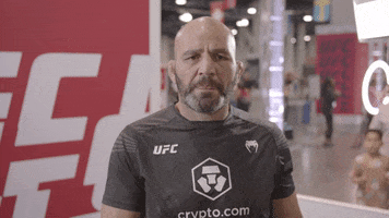 Sports gif. MMA fighter Glover Teixeira looks at us disapprovingly, then puts a finger up and shakes it as he shakes his head no.
