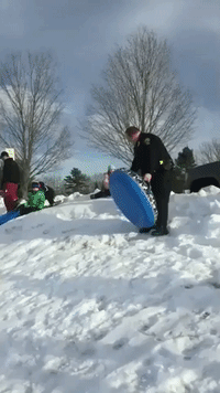 Six-Year-Old Twins Take on Maine Police Officer in Sled Race