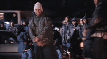 Celebrity gif. Wu Tang Clan a hip hop group sings through a montage of a night time cityscape. Text, "Cash rules everything around me," "CREAM," "Get the money," "Dolla Dolla Bill Y'all". Text repeats.
