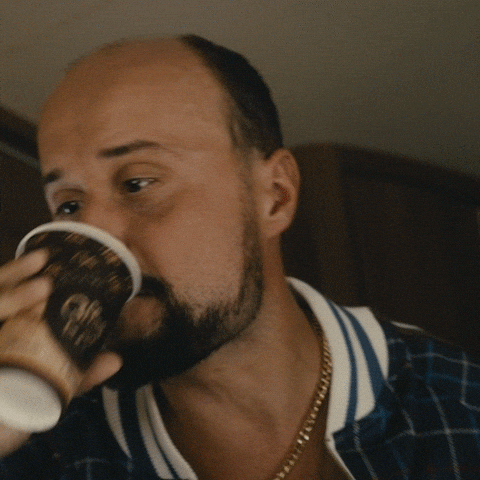Ad gif. An ad for Fio Banka where a man tilts his head back as he shakily drinks from a coffee cup. The drink is disgusting and he struggles to keep it down.