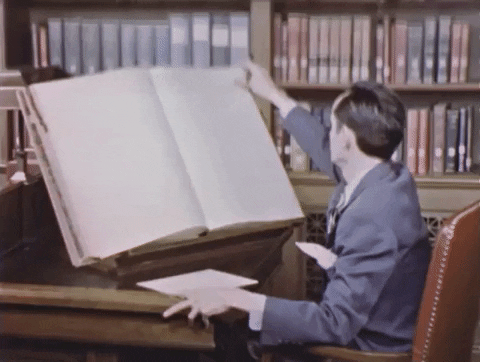 an animator doing research on a big book
