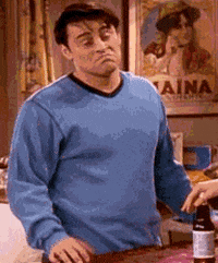 Friends gif. Matt Leblanc as Joey shugs and gives a large frown as if he doesn't really care.