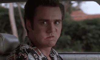 reaction angry mad jim carrey pissed GIF