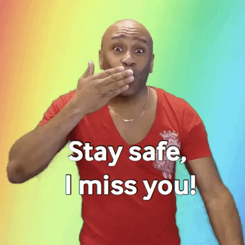 Video gif. Wearing a red t-shirt with a low collar, an energetic Robert E. Blackmon blows kisses at us with both hands. Text, "Stay safe, I miss you!"