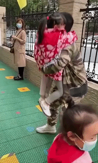 Chinese Man Lifts His Four-Year-Old Triplets After