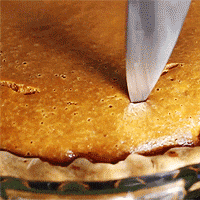 filling pumpkin pie GIF