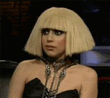 Celebrity gif. Lady Gaga quirks the side of her mouth, conveying discomfort.