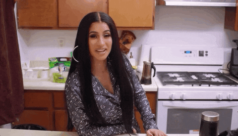  vogue smirk cardi b pleased told you so GIF