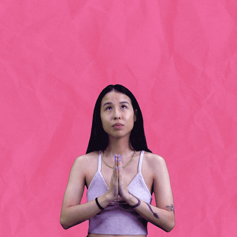 Digital art gif. Woman stands with her hands pressed together in a prayer gesture, looking up to the sky and nodding her head gratefully. Text above her says, "Thanks Dad," with blue hearts, all against a pink background.