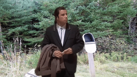 Gif of John Travolta in Pulp Fiction gesturing around and looking confused (photoshopped into a random grassy background) 