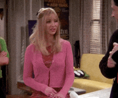 Friends gif. Lisa Kudrow as Phoebe speaks to someone offscreen. Text, "Good luck. Good luck." She holds up her hands as we see signs of annoyance on her face. Text, "We all wish you." Her eyes widen, and her fingers stiffen as she brings her hands closer to her head. We can see now that she's very irritated. Text, "Good luck!"