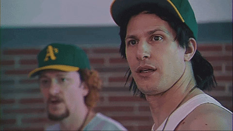 Celebrity gif. Andy Samberg as Jose Canseco and Akiva Schaffer as Mark McGwire in The Unauthorized Bash Brothers Experience reacts with shock, their jaws dropping.