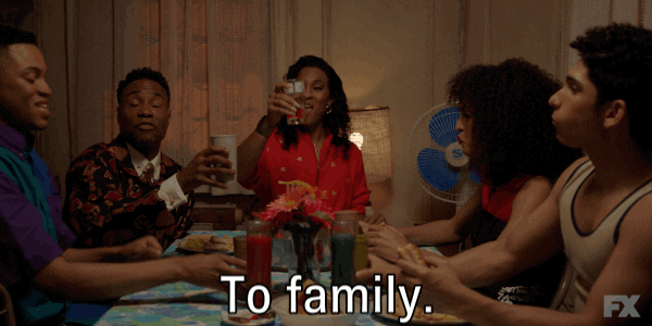 Family toasting at dinner table (maybe right after agreeing to make donation)