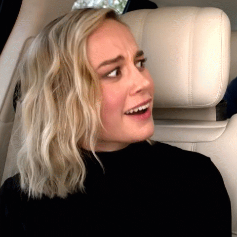 Movie gif. Sitting in a car, Brie Larson as Captain Marvel smiles and nods her head in agreement. Text, “True.”
