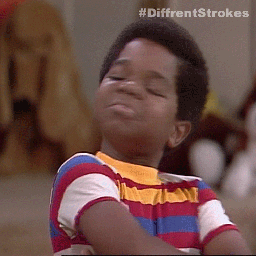 TV gif. Gary Coleman as Arnold from Diff'rent Strokes looks around proudly with arms folded.
