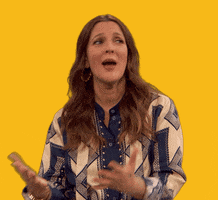 Celebrity gif. Drew Barrymore turns to the side and presses her palms together as she earnestly says, "Thank you."