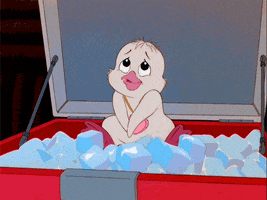 Movie gif. A baby penguin in The Chipmunk Adventure sits in a cooler of ice and crosses it's flippers bashfully before waving at us. 