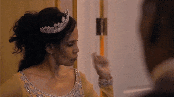 Movie gif. Shari Headley as Lisa in Coming to America purses her lips in frustration and points with her arm as her head flicks to the side.