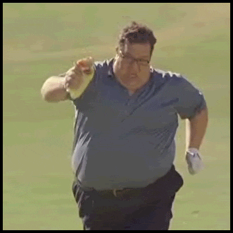 Video gif. A heavier man struggles to run down a field with what looks like a  burrito in his hand.
