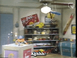 TV gif. Nineties-era children's television show features an orange puppet boy wearing a baseball cap and working at a desk. The puppet boy shakes his head in frustration over something he's working on and says, "Aghhh! I messed up again. Ugh. This is so frustrating."