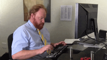 Video gif. Man theatrically presses a button on his keyboard and leans back in his office chair as he looks at us, exasperated.