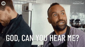 Reality TV gif. Archie Thompson on MasterChef Australia lifts his head up with a smile on his face and says, “God, can you hear me?”
