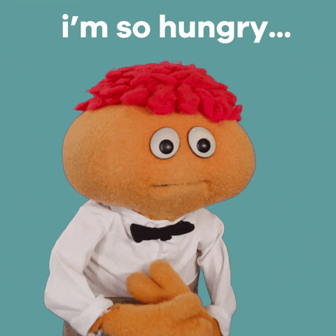 TV gif. Gerbert the puppet rubs his belly and looks up. Text, "i'm so hungry."